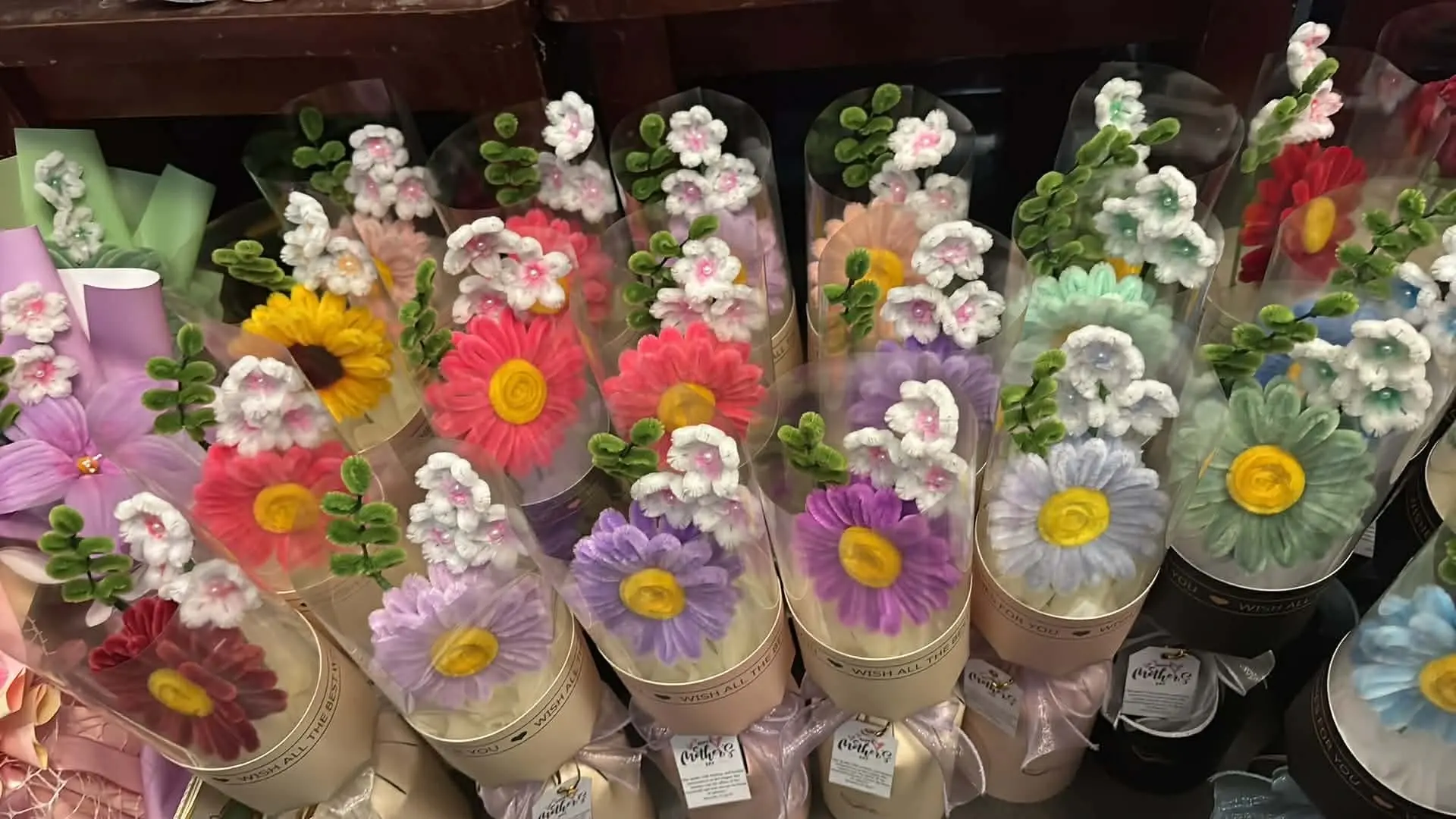 FleurKraft kraft cylinder bouquets â€” handcrafted arrangements in brown and black gift packaging