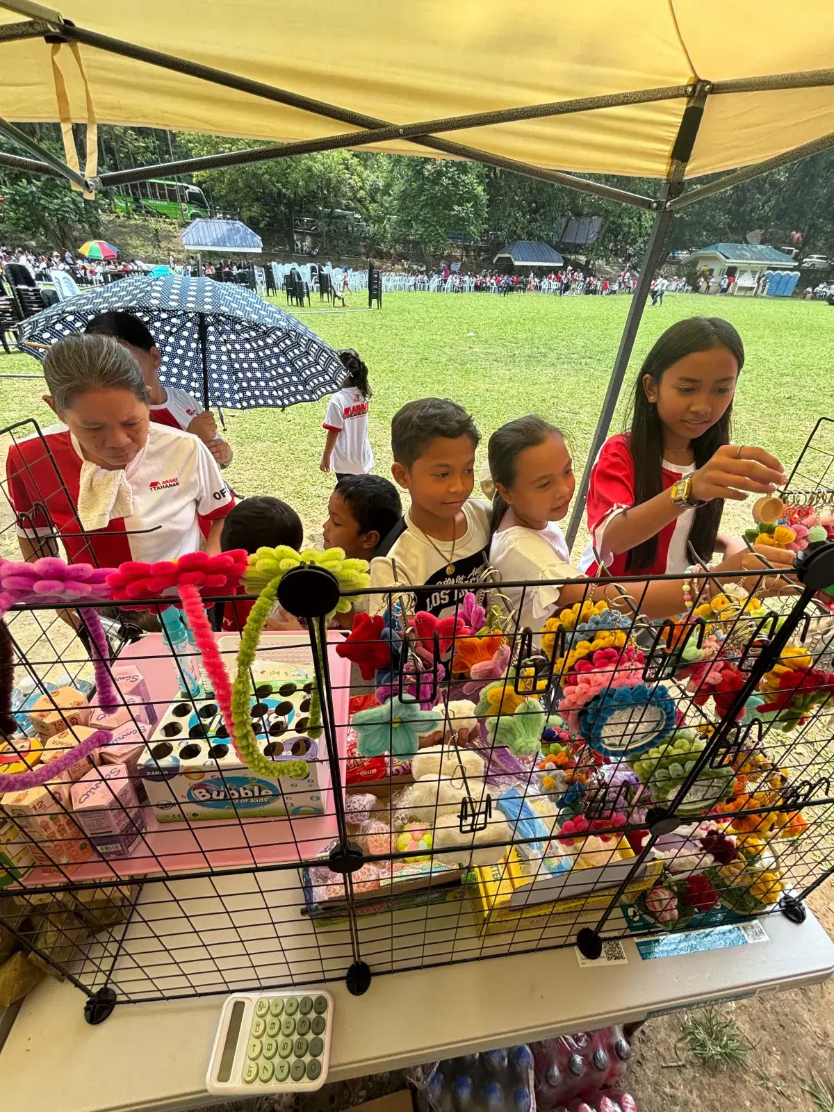 Handmade fuzzy wire flower keychains, mini flower pots, and headbands by FleurKraft at the Talamban Cebu City booth